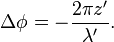 ~\Delta \phi =-{\frac  {2\pi z'}{\lambda '}}.